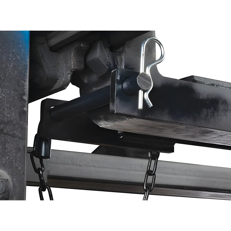 Close-up of a metal hitch pin and chain attachment on Star Industries 1664 equipment