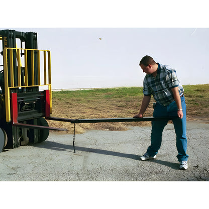 Man inspecting forklift attachment Star Industries 1665 extending forks in outdoor setting