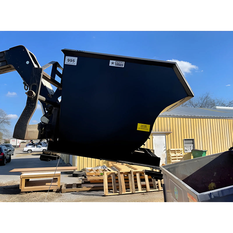 Star Industries 1805N self-dump hopper in black attached to loader arm with clear sky background