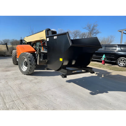 Star Industries 1825 self dump hopper attached to an orange construction vehicle on pavement
