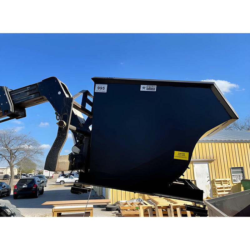 Star Industries 1825 black self-dump hopper attached to forklift outdoors near yellow building