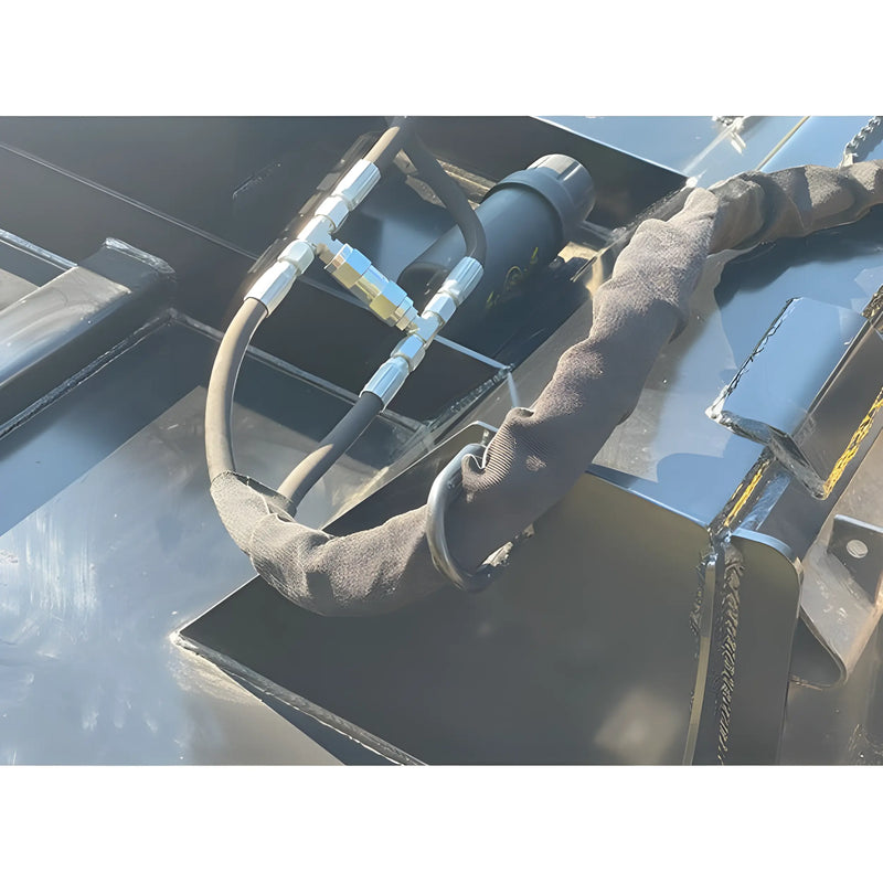 Close-up of hydraulic hoses and fittings on Star Industries 195-72 heavy equipment attachment