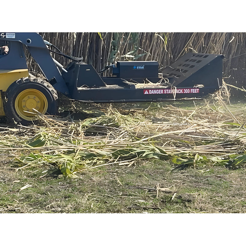 Star Industries 195-72 heavy-duty mulching attachment on a skid steer clearing brush