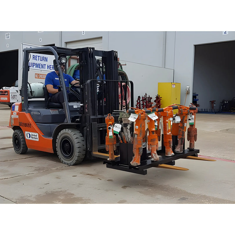 Star Industries 920 forklift carrying multiple orange hydraulic tools in industrial warehouse