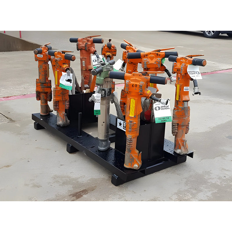Set of orange and gray Star Industries 920 pneumatic tools on a black metal rack outdoors
