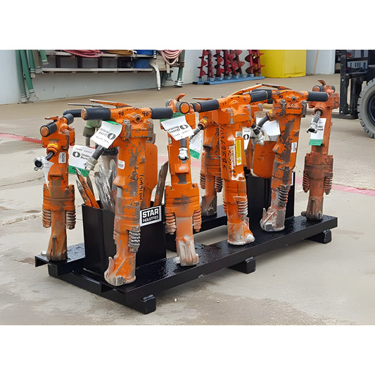 Set of orange Star Industries 920 pneumatic tools lined up on a black metal stand outdoors