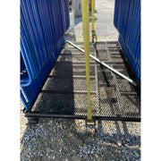 Star Industries 931 black metal mesh platform with yellow strap and blue barriers on gravel ground